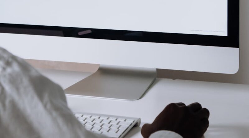 silver imac on white table